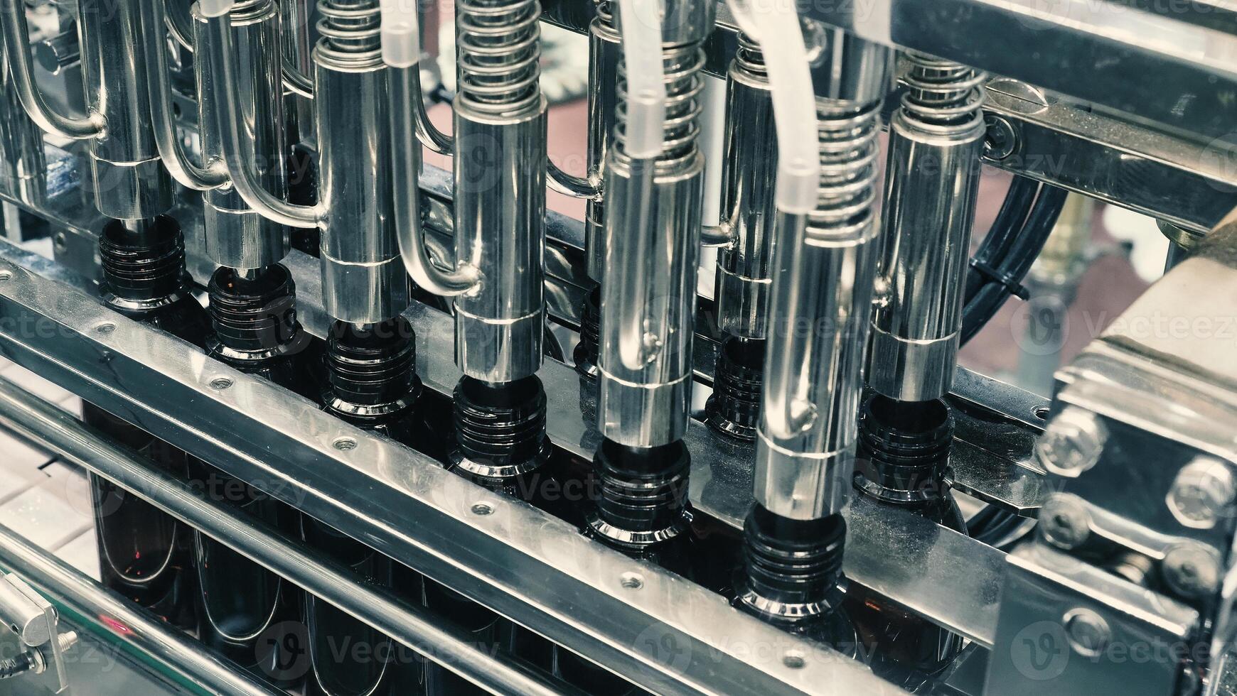 Technology demonstration of filling and capping bottles in the industry. photo
