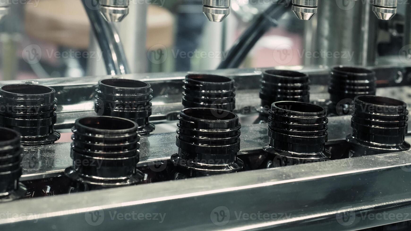 Technology demonstration of filling and capping bottles in the industry. photo