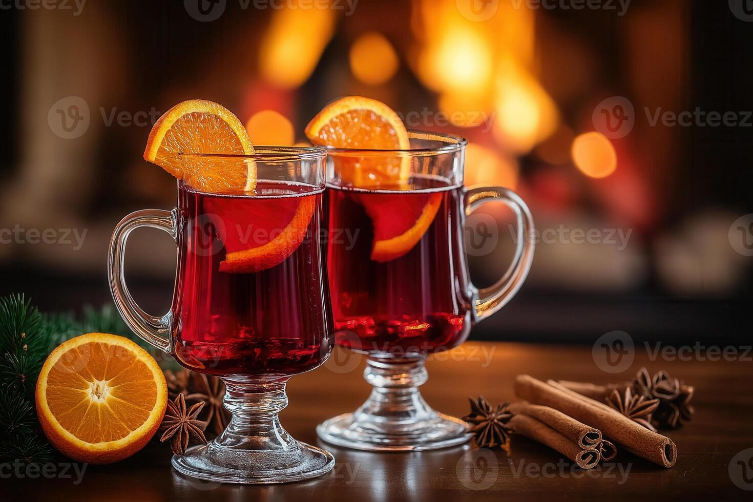 two glasses of mulled wine with oranges and cinnamon photo