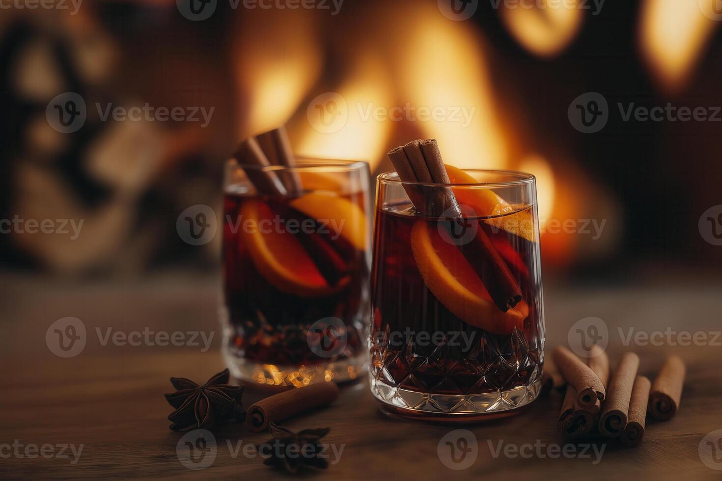 Two glasses of red mulled wine. Hot winter drink with cinnamon, cardamom, orange, anise, Selective focus, soft blurred background, bokeh photo