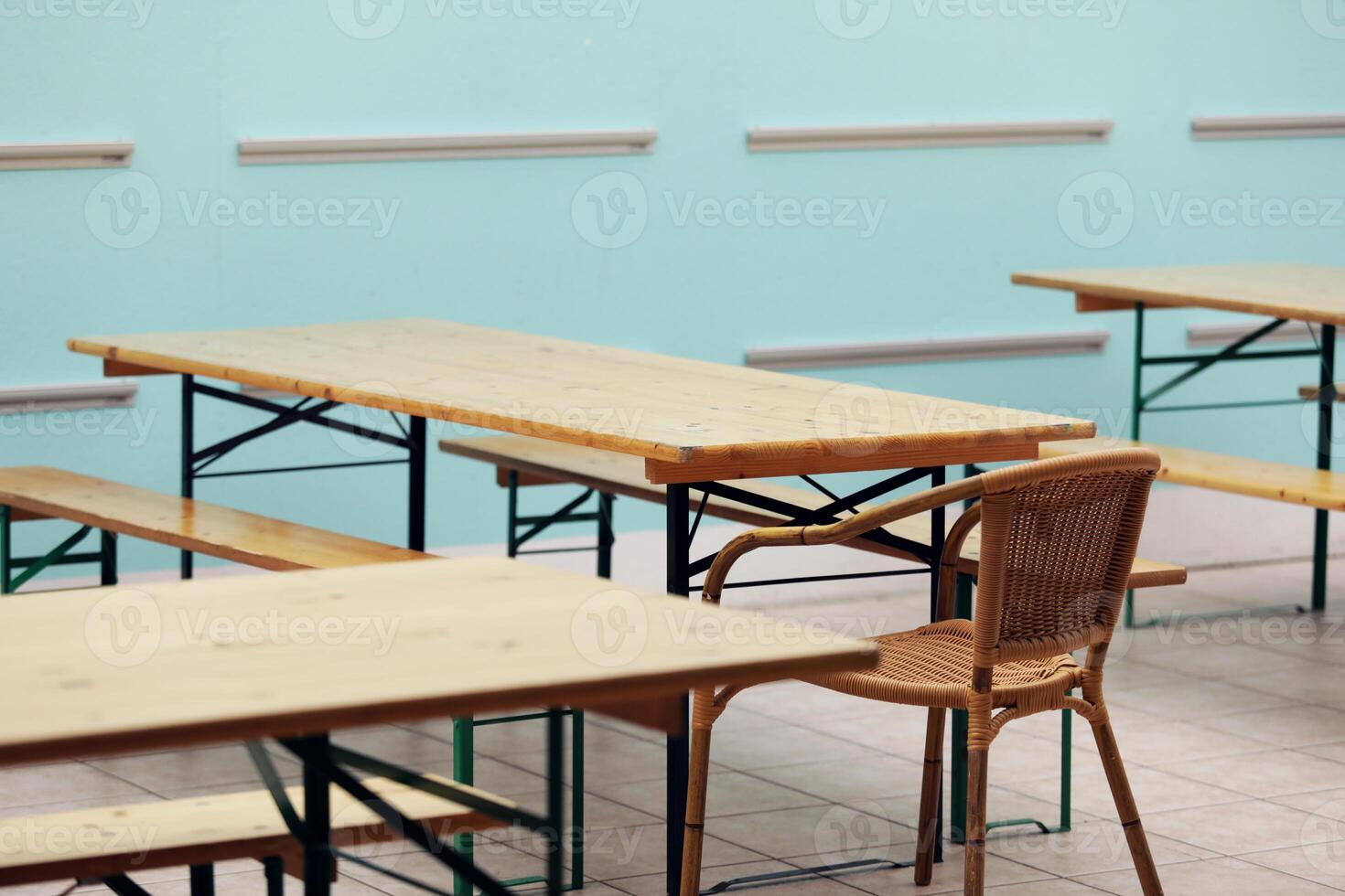 Empty wooden tables and chairs in the dining room photo