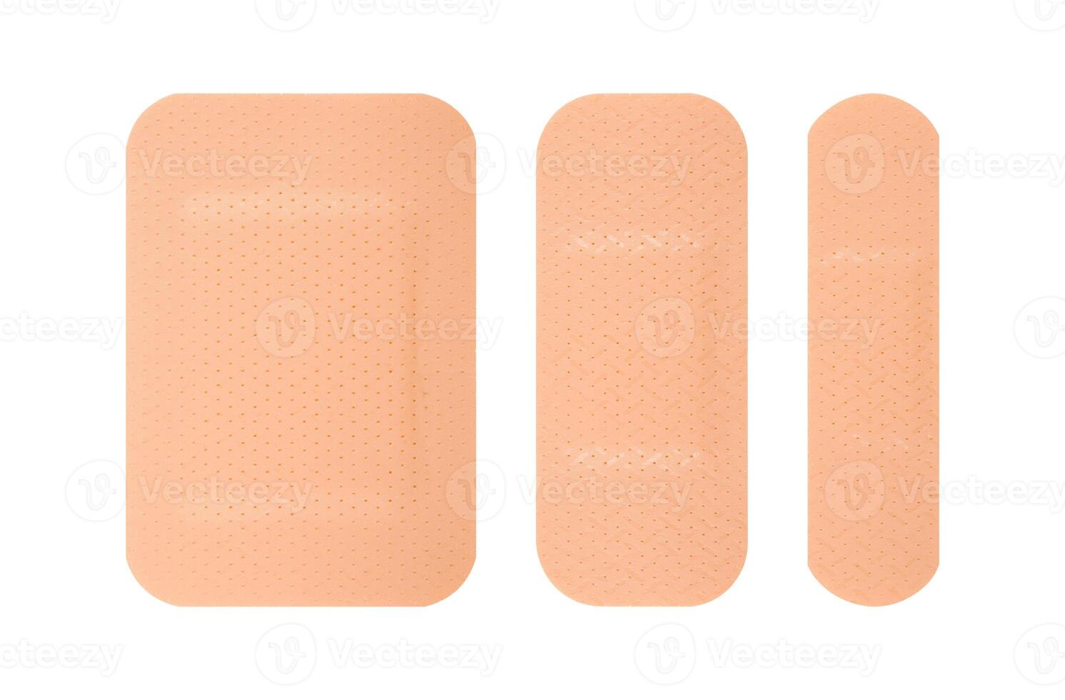 Assorted skin tone adhesive bandages isolated on a white background. Stock photo