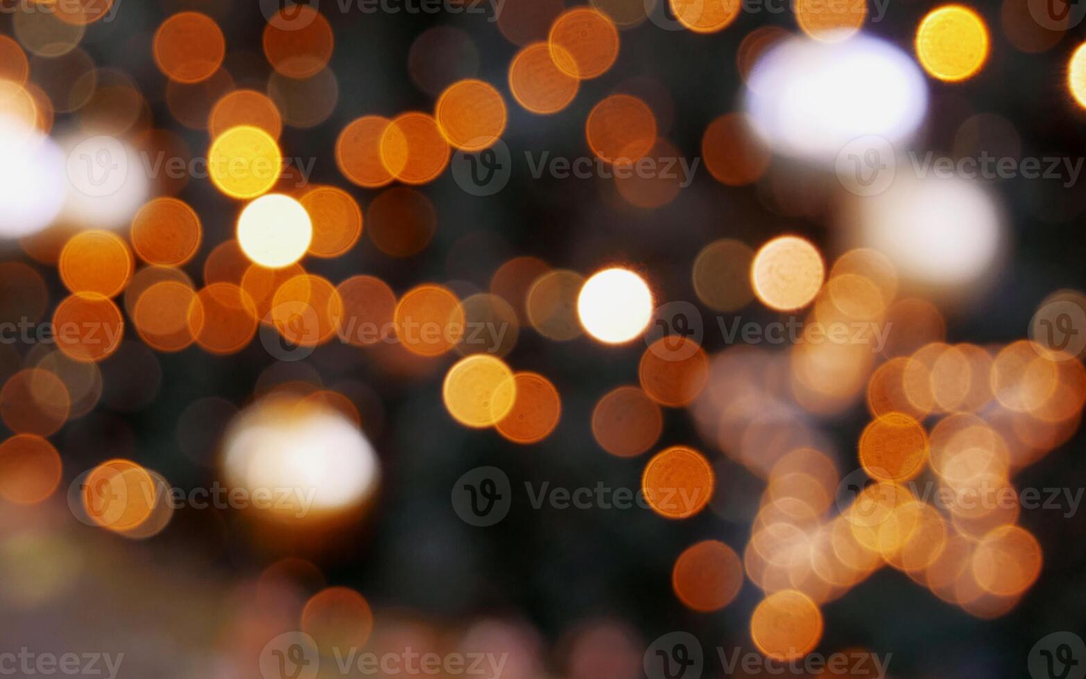 Christmas tree with glowing garland blurry defocused photo. Abstract bokeh background wallpaper. Christmas and New Year celebration concept photo