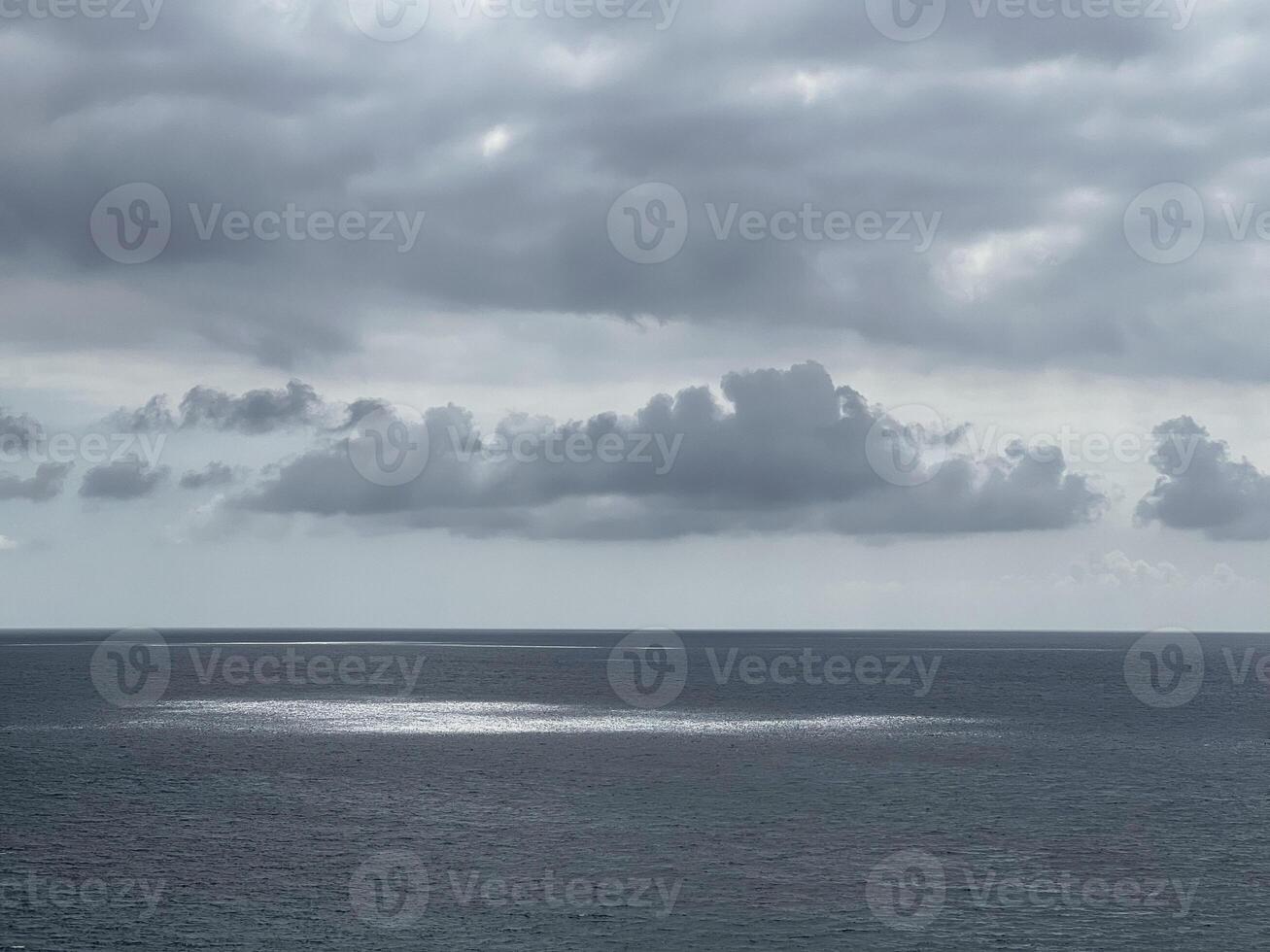 Glare on the sea. Sunlight reflected on the surface of the water. Seascape sun glare background wallpaper photo