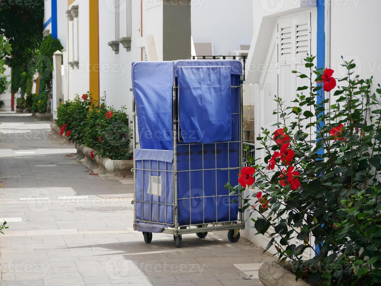 Hotel trolley for bed linen and towels at the street of Puerto de Mogan, Gran Canaria. The concept of tourism and service photo