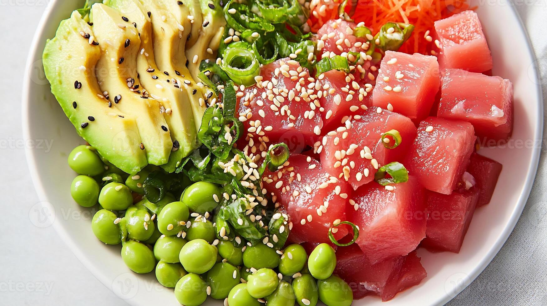 A bowl of sushi with avocado, tuna, and green peas photo
