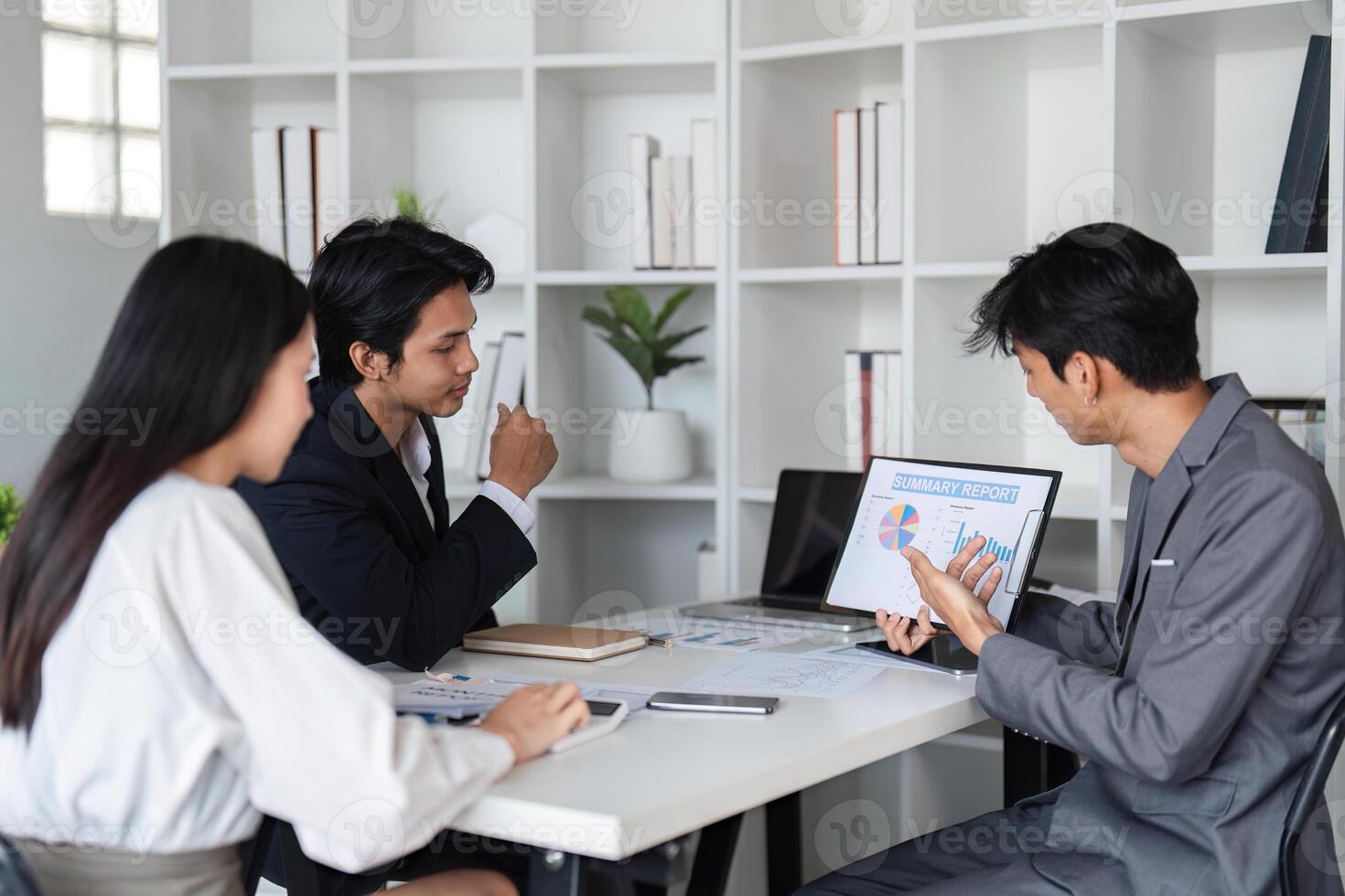 Business Team Collaborating in Modern Office, Exchanging Ideas and Discussing Work Strategies photo