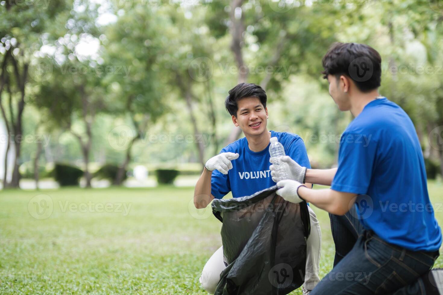 Volunteers Collecting Trash in a Park to Promote Environmental Awareness and Community Cleanliness photo