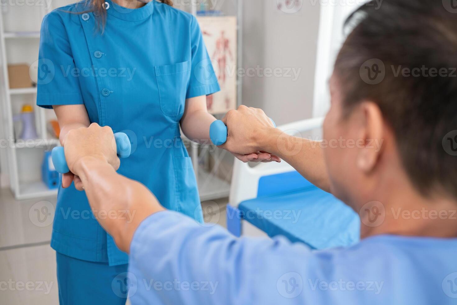 Young Caregiver Assisting Elderly Patient with Physical Therapy Exercises in a Modern Healthcare Facility photo