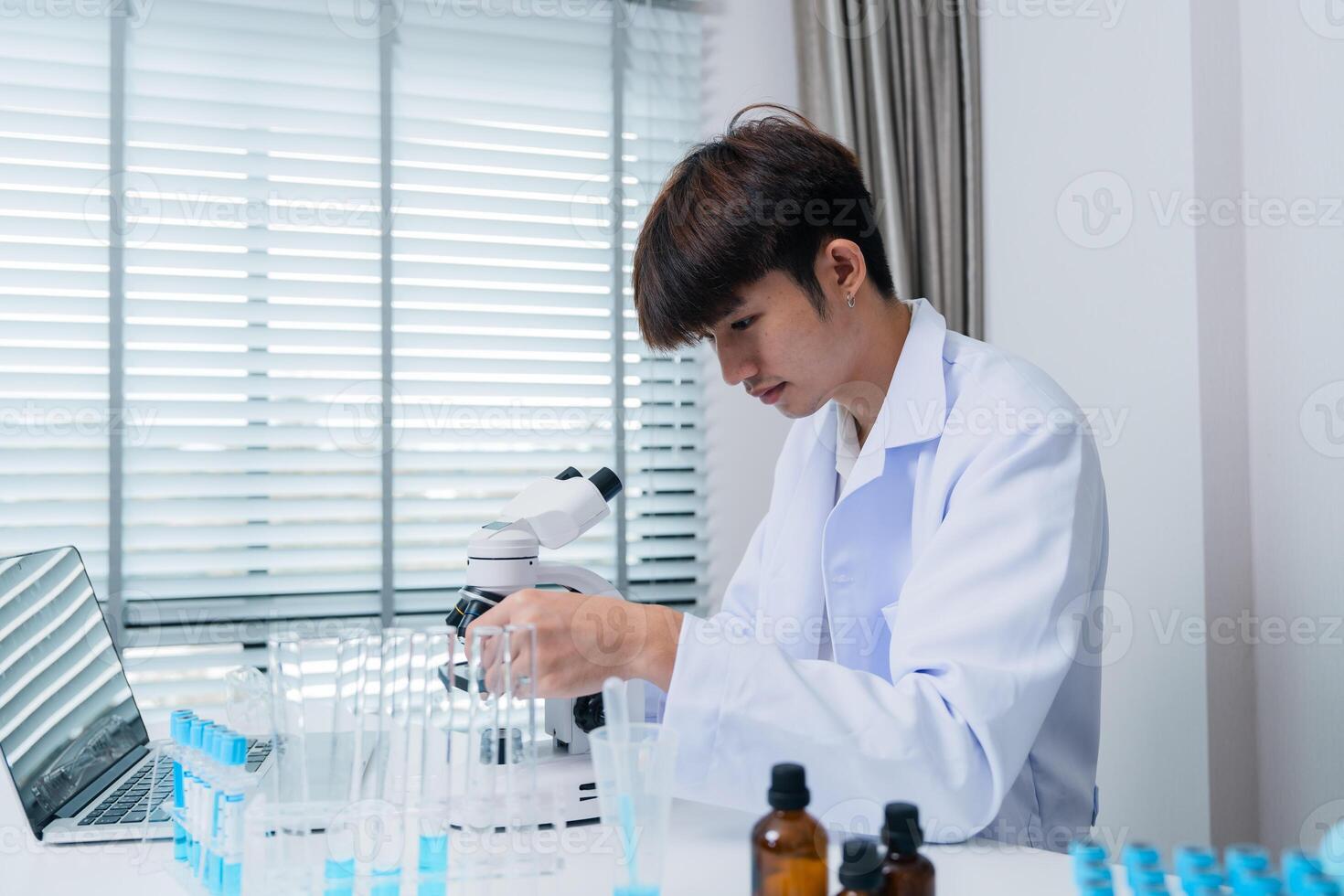 Young Scientist in Laboratory Conducting Innovative Drug Research with Advanced Equipment and Technology photo