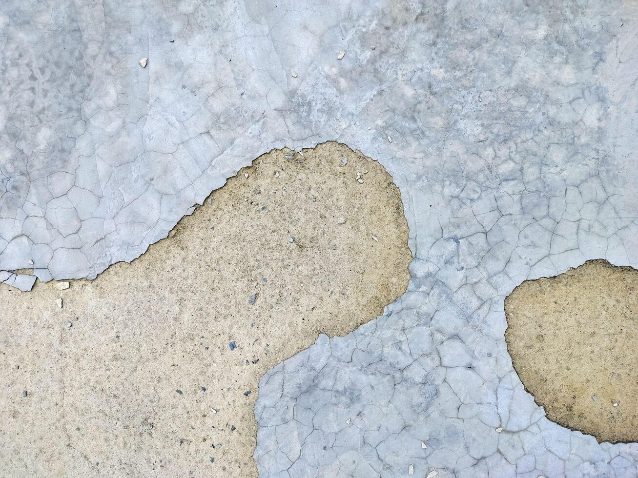 Cracked concrete floors, concrete floors that have been used for a long time. photo