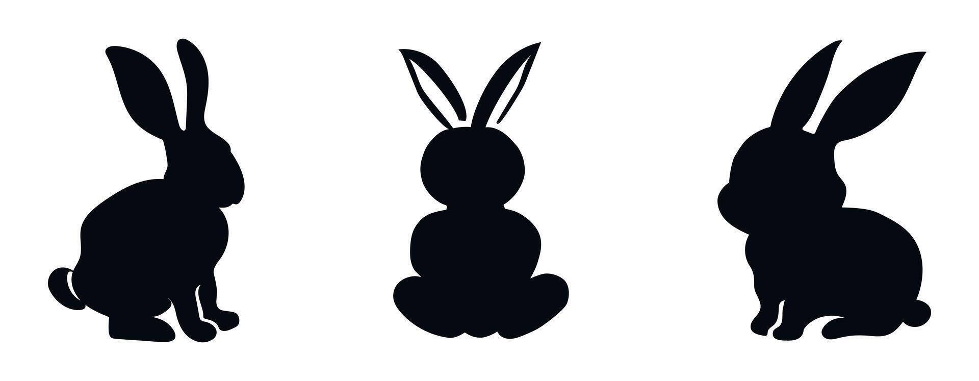 Set of black silhouettes of rabbits isolated on a white backgrou vector