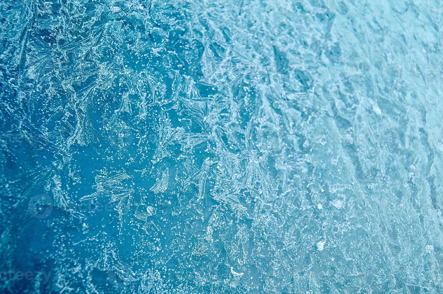 Winter frost patterns on the glass photo