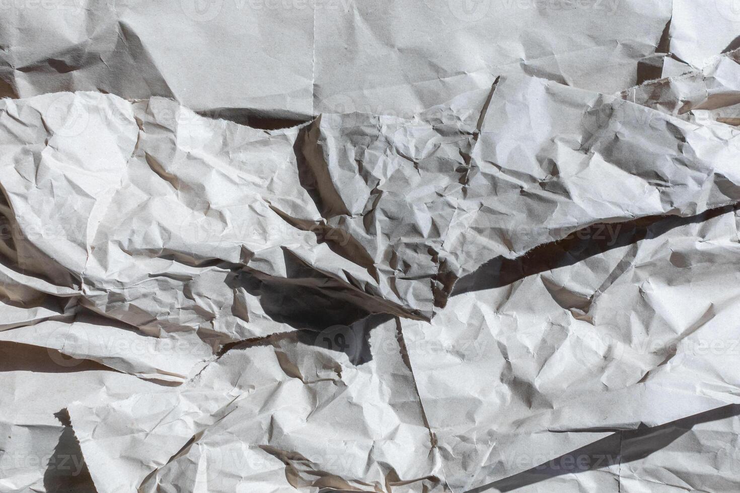 A textured background of crumpled white paper symbolizing chaos and creativity, perfect for concepts of recycling or brainstorming photo