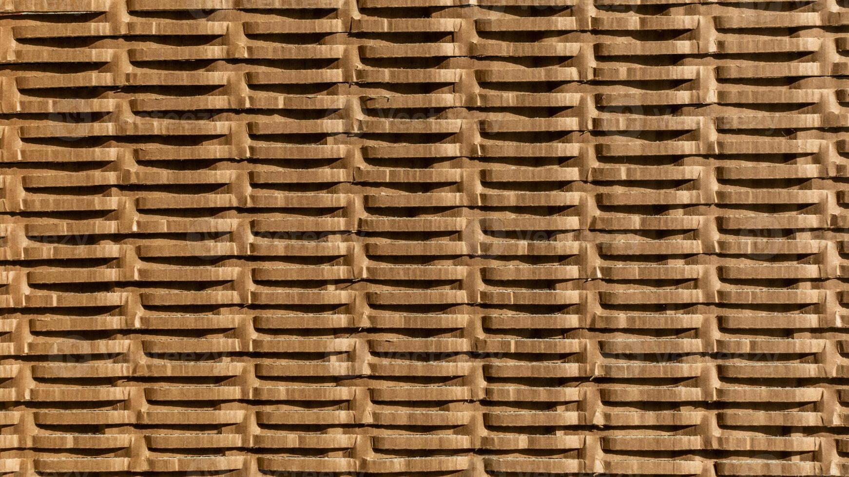 Stacked cardboard boxes create a textured pattern, symbolizing sustainability and recycling concepts, ideal for Earth Day themes photo