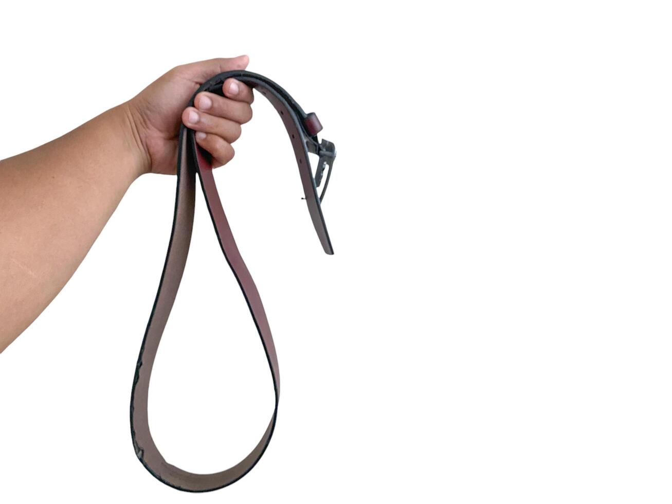 Man holding a leather belt photo