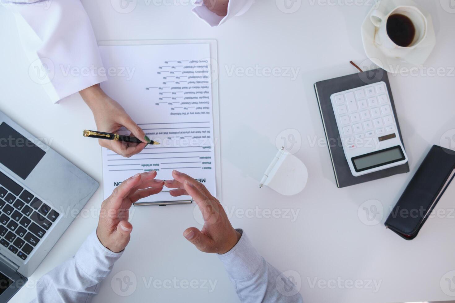 woman consults dentist about her toothache for treatment in dental clinic and dentist gives advice on right symptoms and treatment method for patient. concept consulting dentist about dental treatment photo