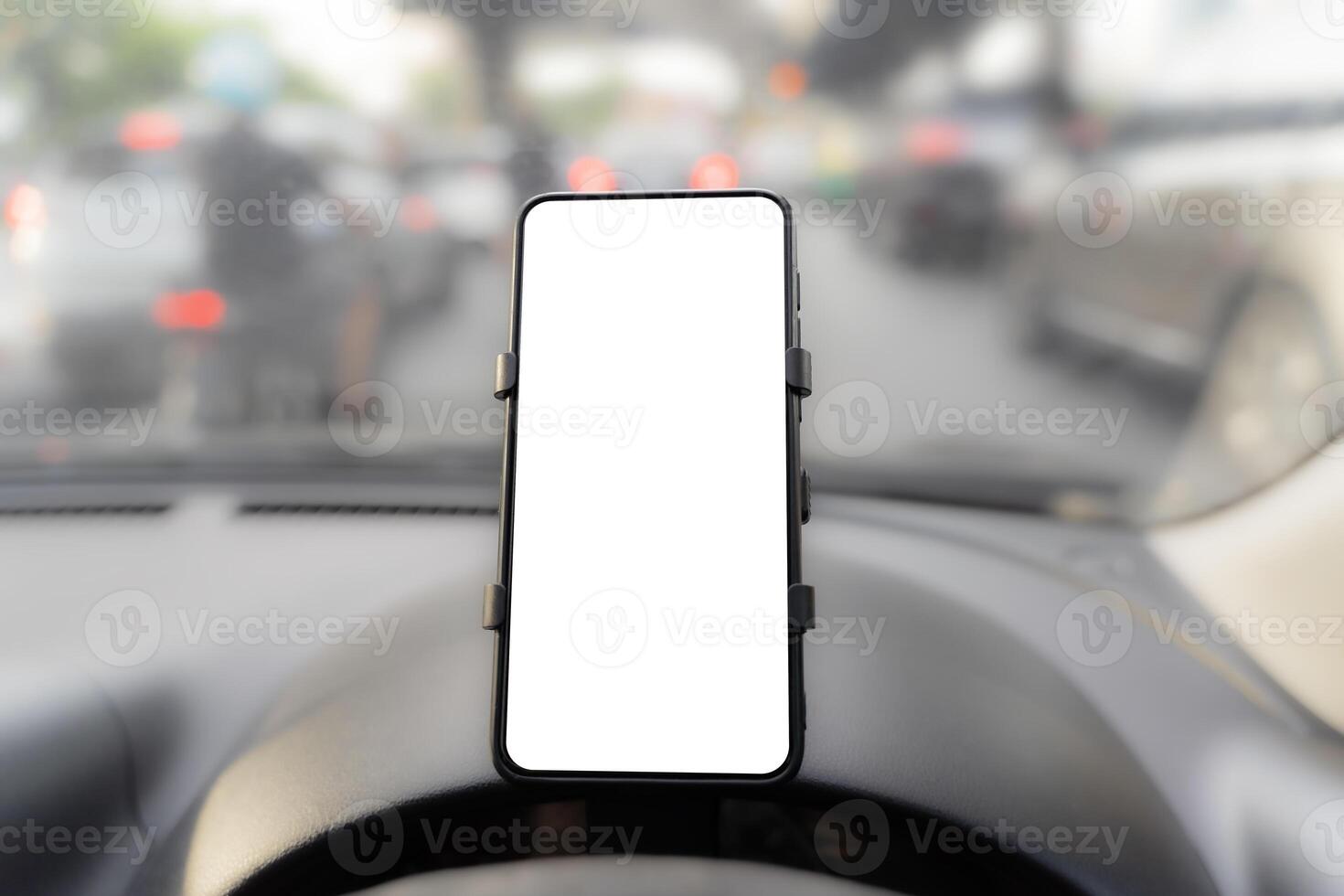 Modern smart phone gadgets. Install on car dashboard phone holder white screen mockup isolated template empty space for driver room view photo