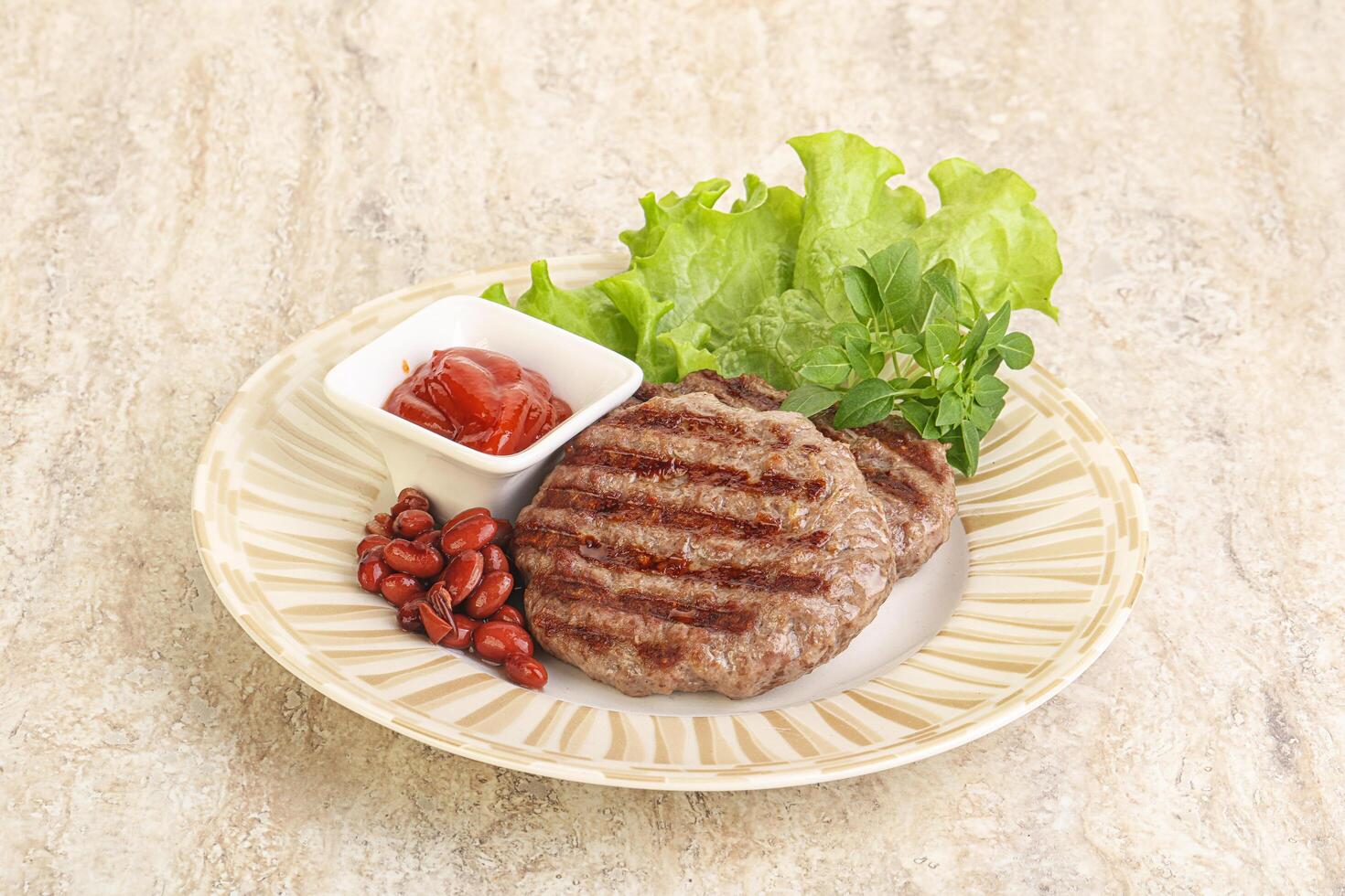 Grilled beef burger cutlet with sauce photo