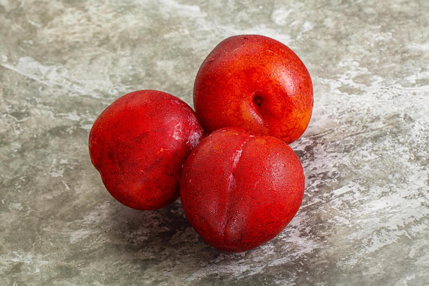 Ripe sweet juicy red plum photo