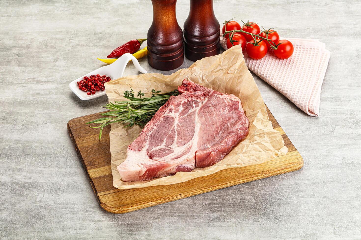 Raw pork neck steak uncoocked photo