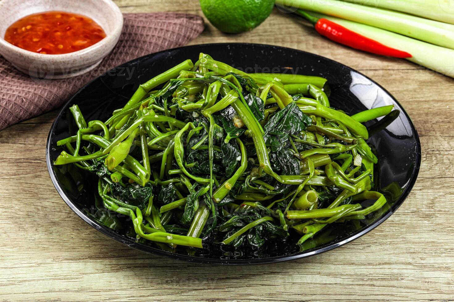 Asian cuisine stir fried morning glory photo