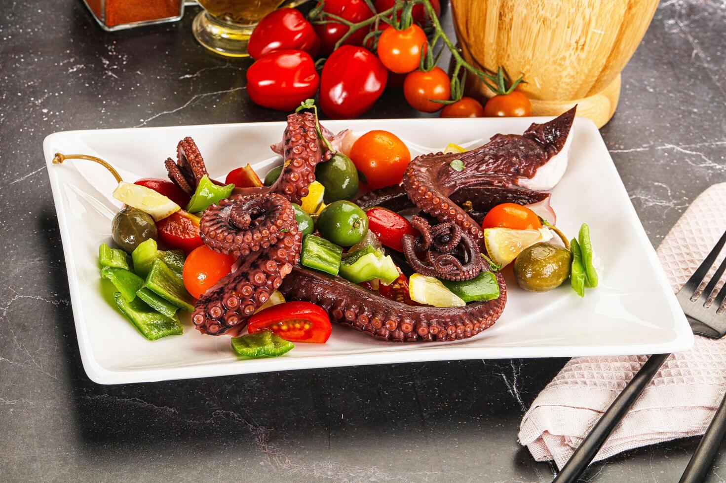 Salad with octopus tentacle and vegetables photo