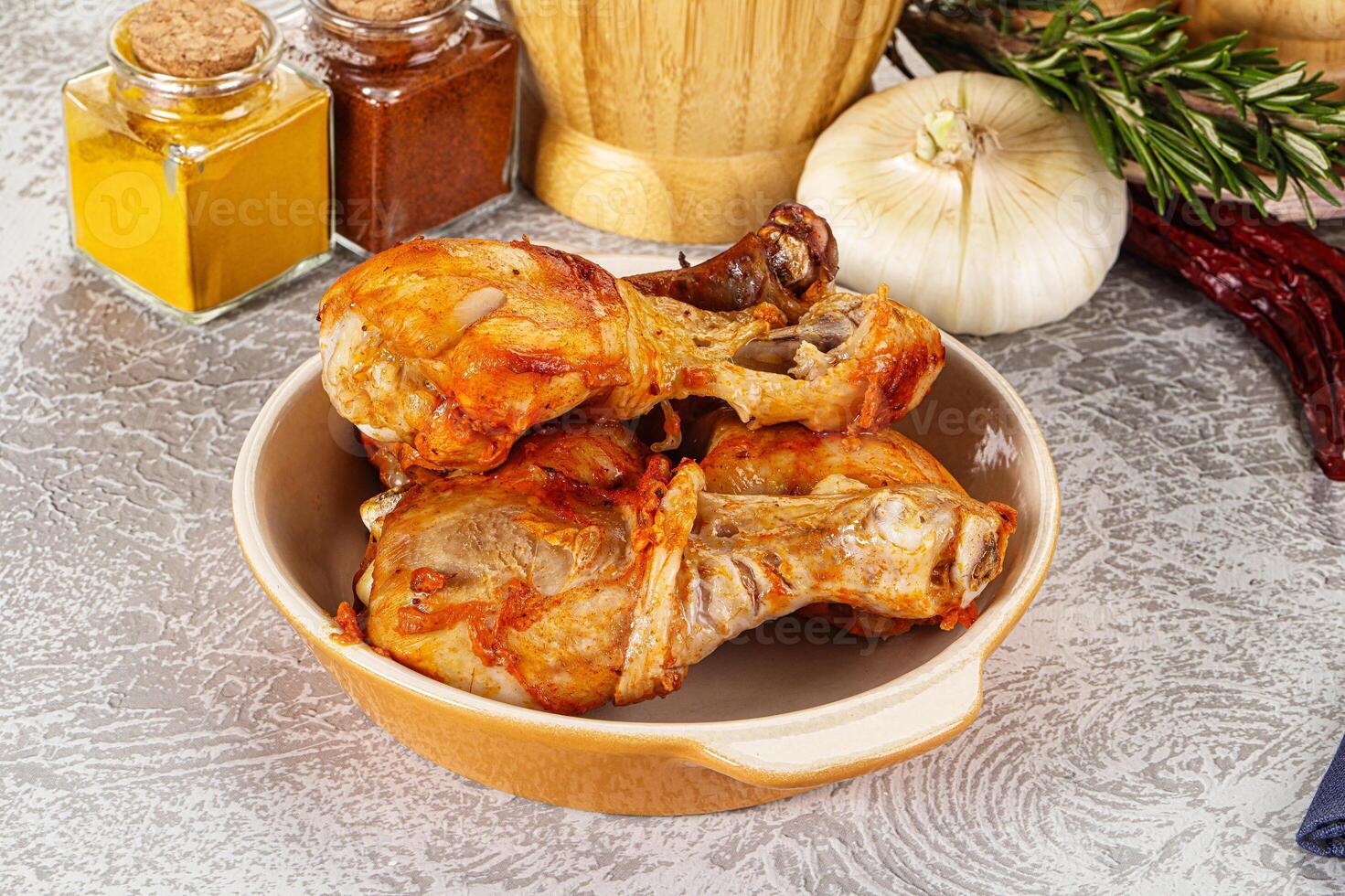 Raw marinated chicken drumstick for cooking photo