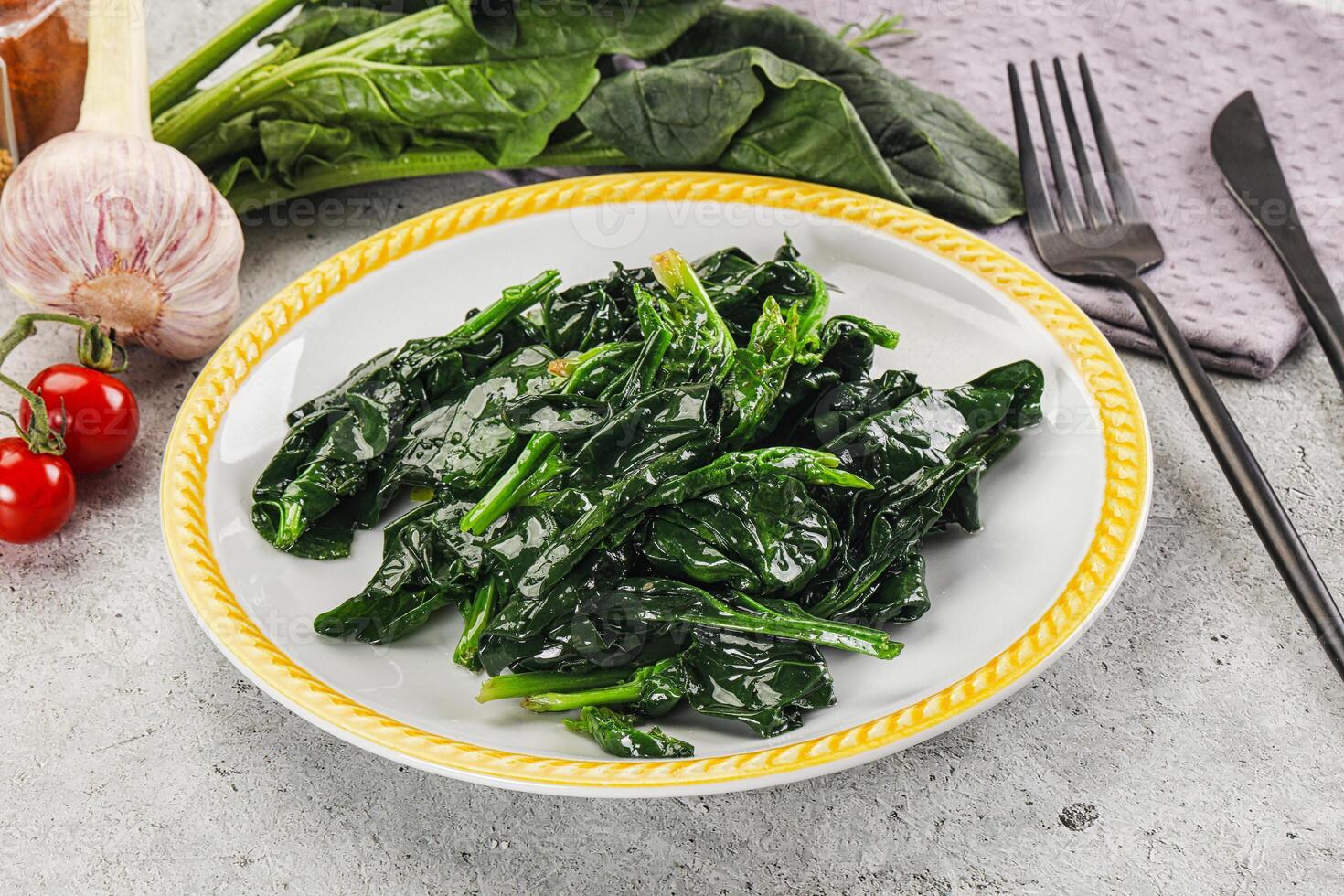 Coocked green spinach with oil photo