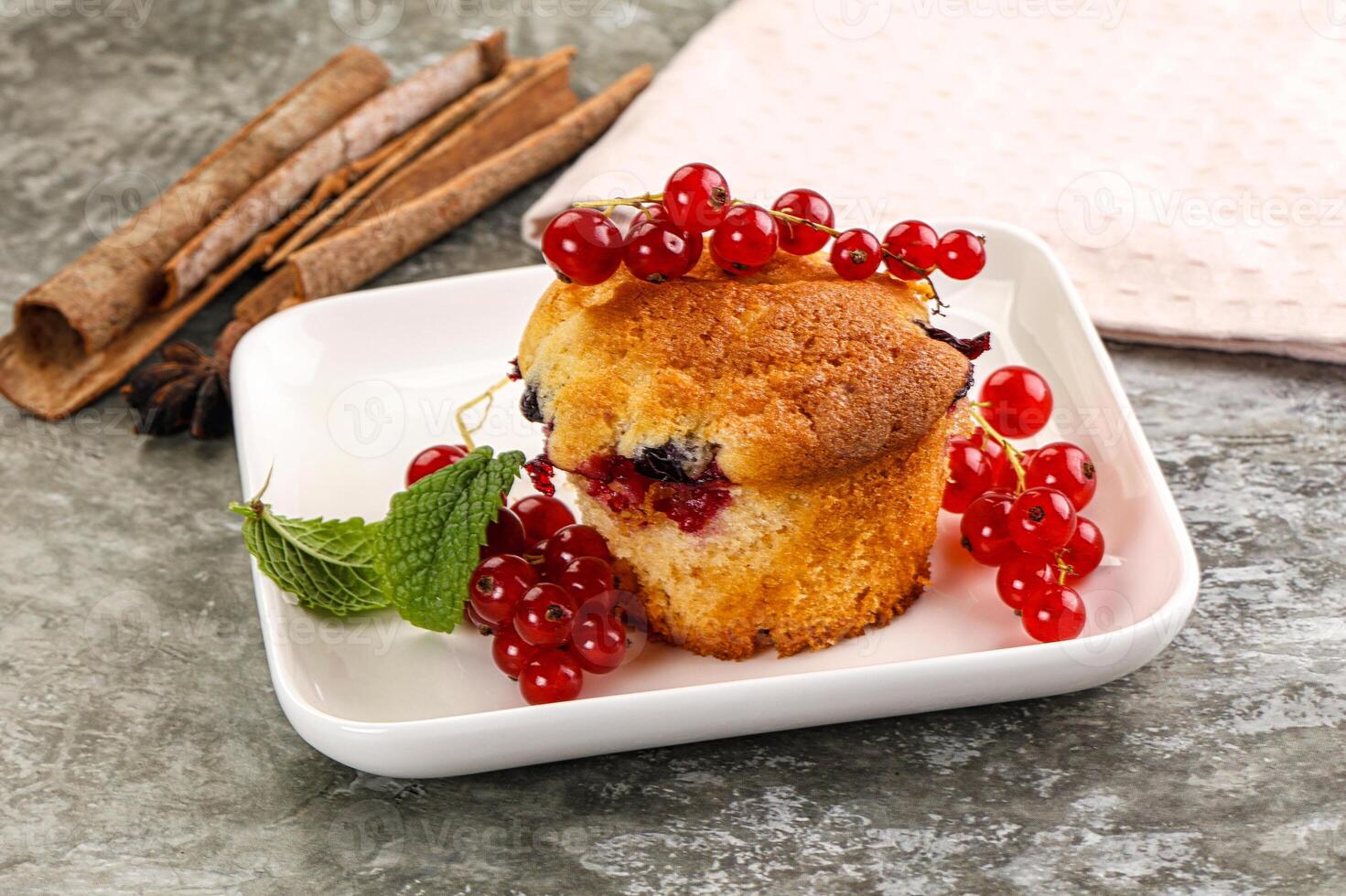 Delicous cupcake with red currant photo