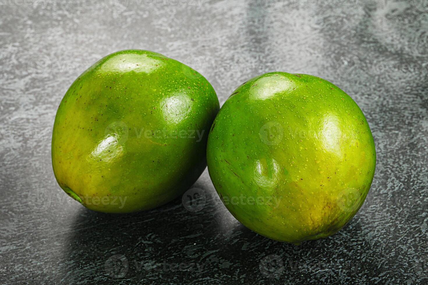 Two ripe green exotic avocado fruit photo