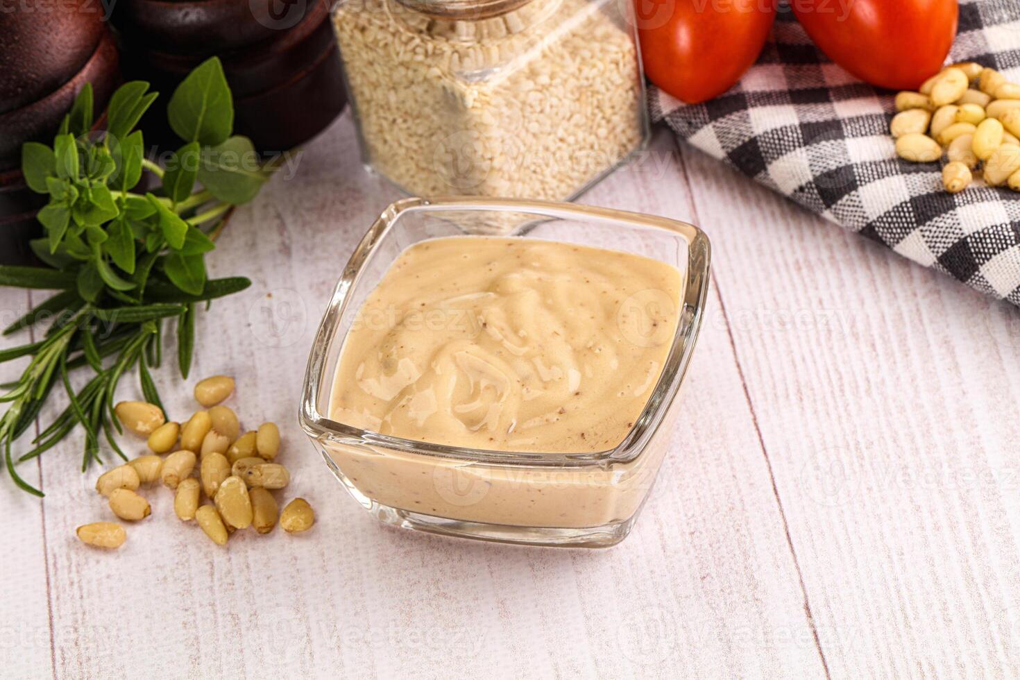 Delicious walnut creamy sauce in the bowl photo