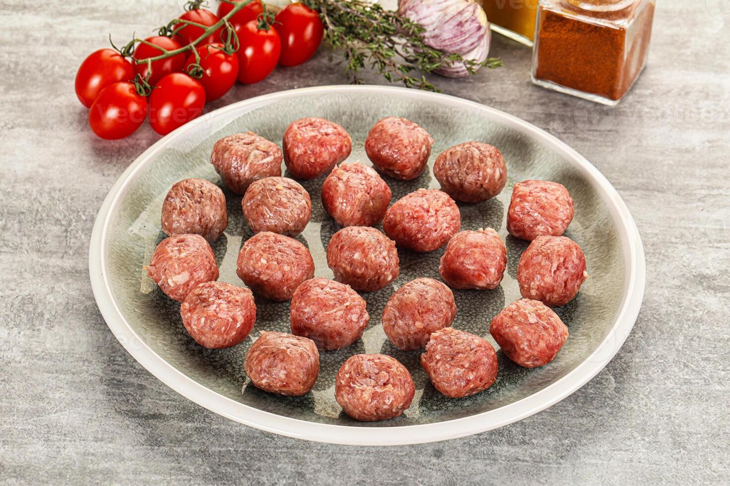 Uncooked raw beef meatball minced photo