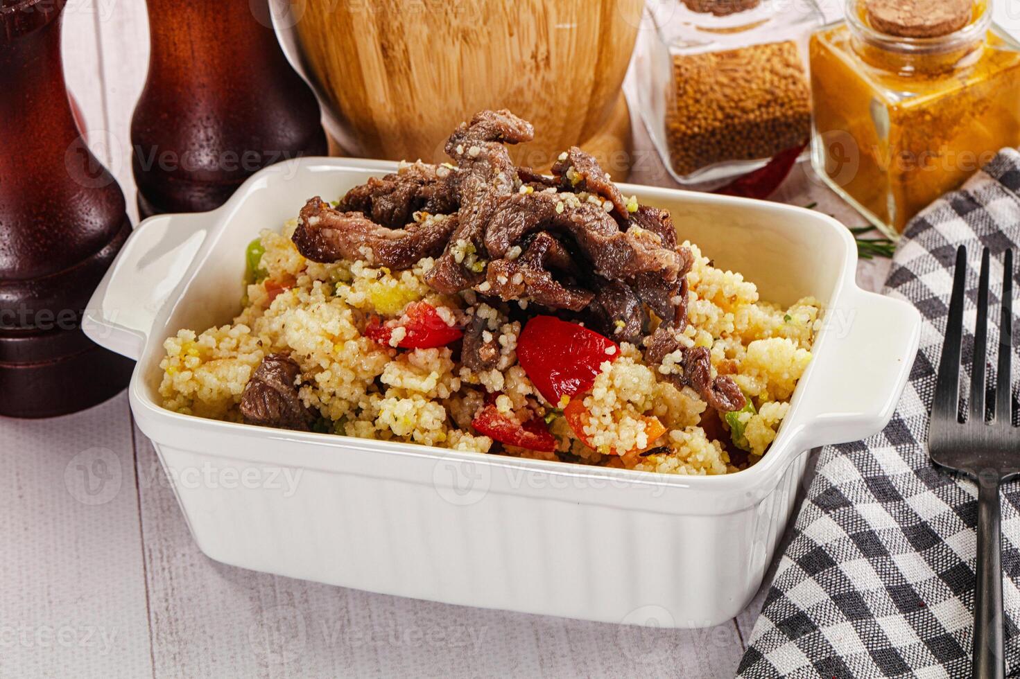 Traditional couscous with beef and vegetables photo