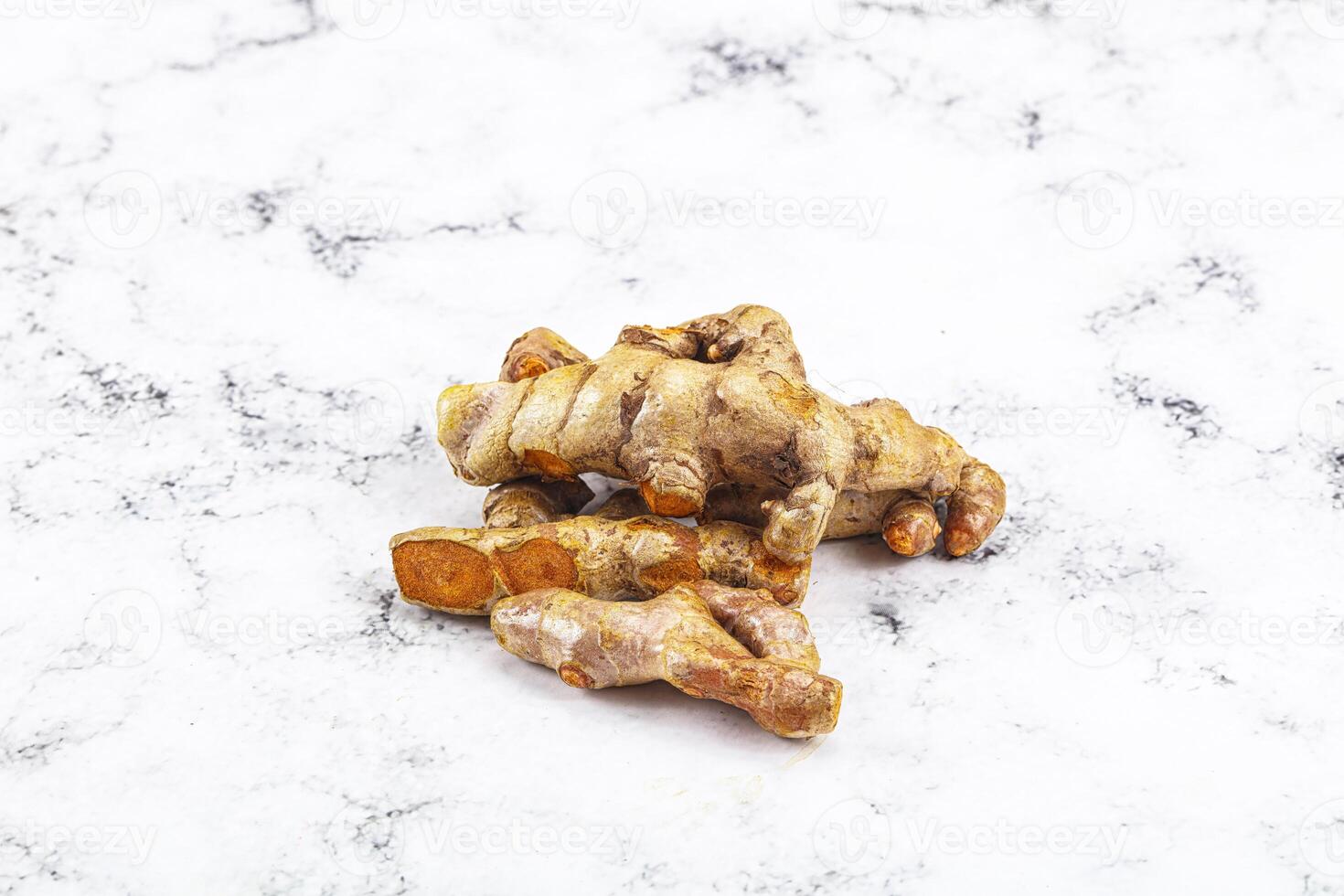 Fresh young Tumeric root heap photo
