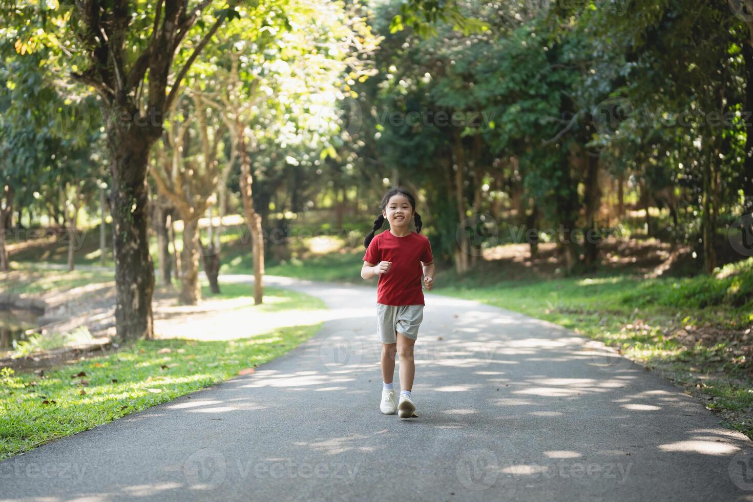 Happy baby Asian girl smiling. little girl running and smiling at sunset happy baby girl smiling. little baby running at sunset. cute baby running at playground garden. photo