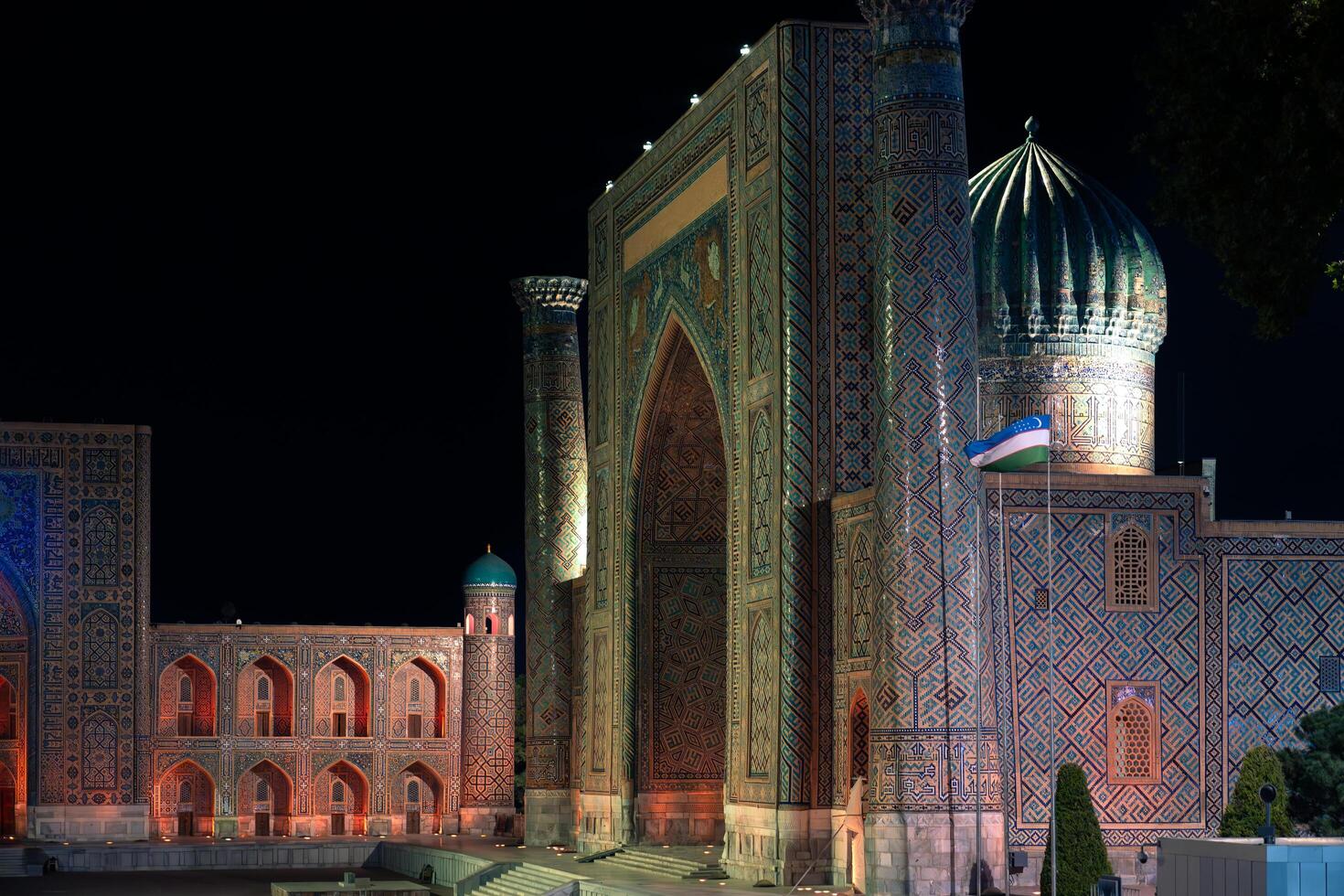 Samarkand, Uzbekistan-august 12, 2023-Particular of the Registan Square with a light show that illuminates all the buildings in the square during a summer night photo