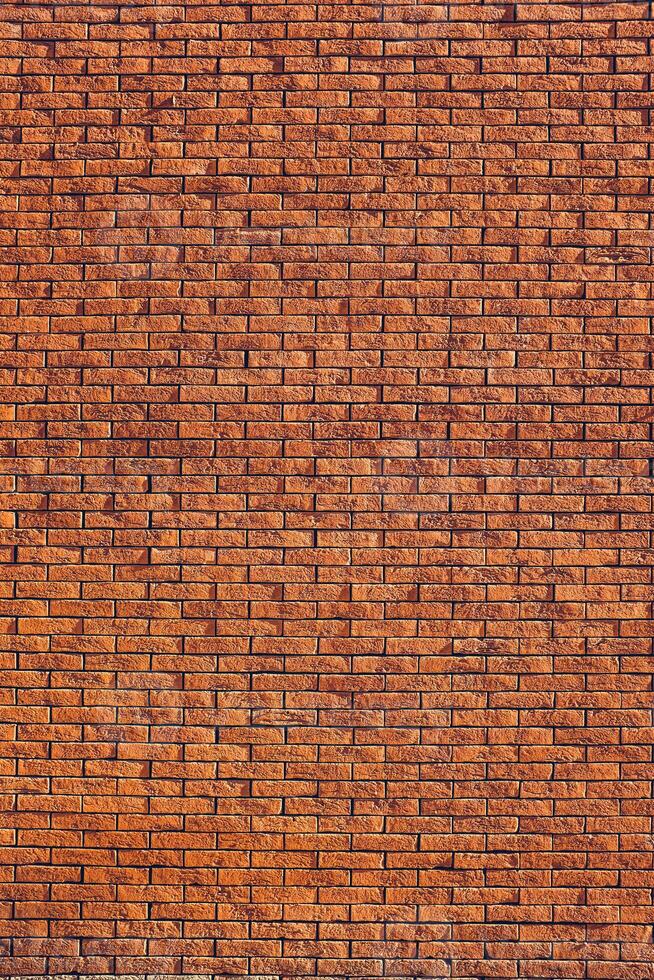 a brick wall with a few small squares photo