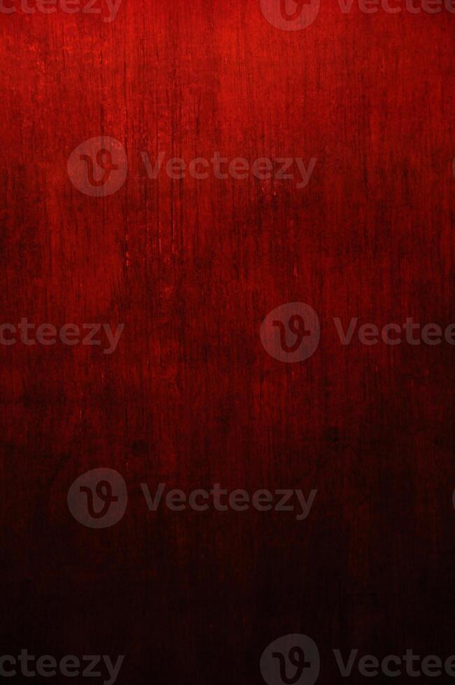 a red painted wall with a dark background photo