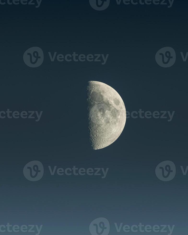 the moon is seen in the sky with a dark sky photo