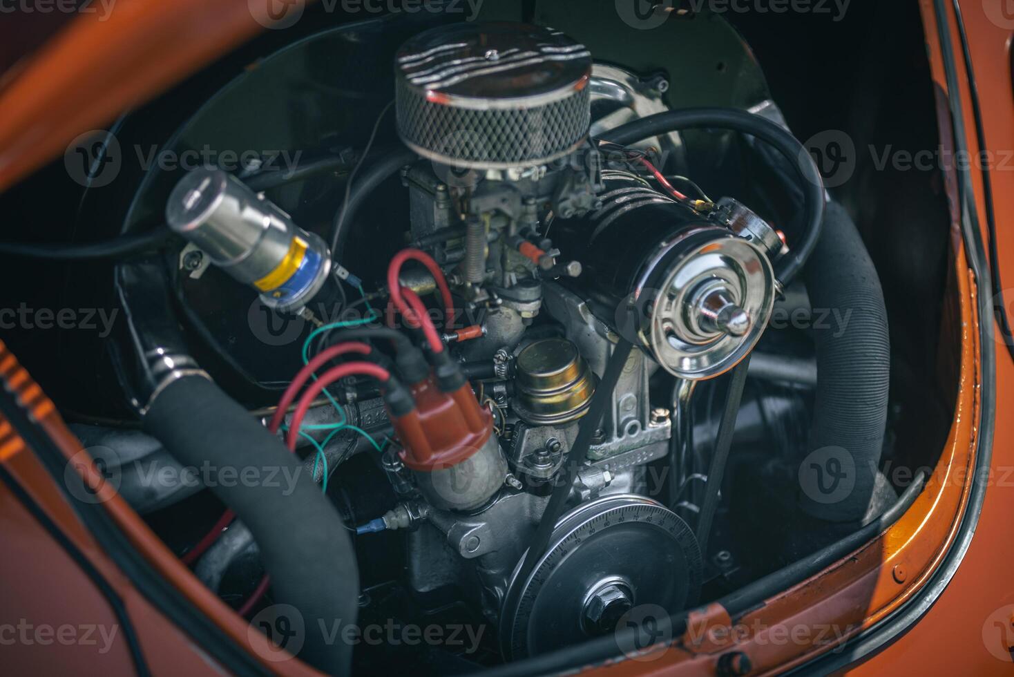 Open bonnet of a classic car displaying fully restored engine compartment. photo