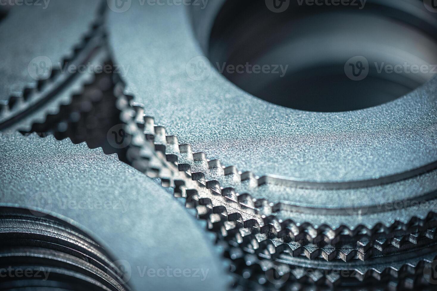 Close up of small metal gears and parts stacked up after production photo
