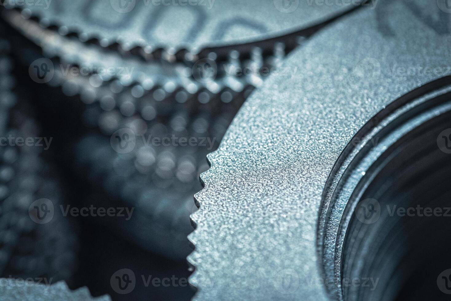 Close up of small metal gears and parts stacked up after production photo