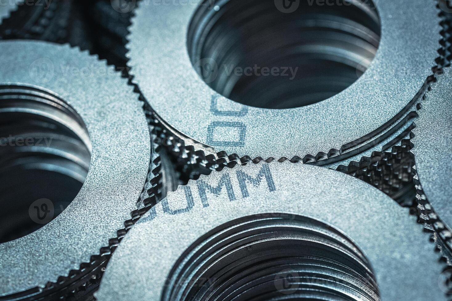 Close up of small metal gears and parts stacked up after production photo