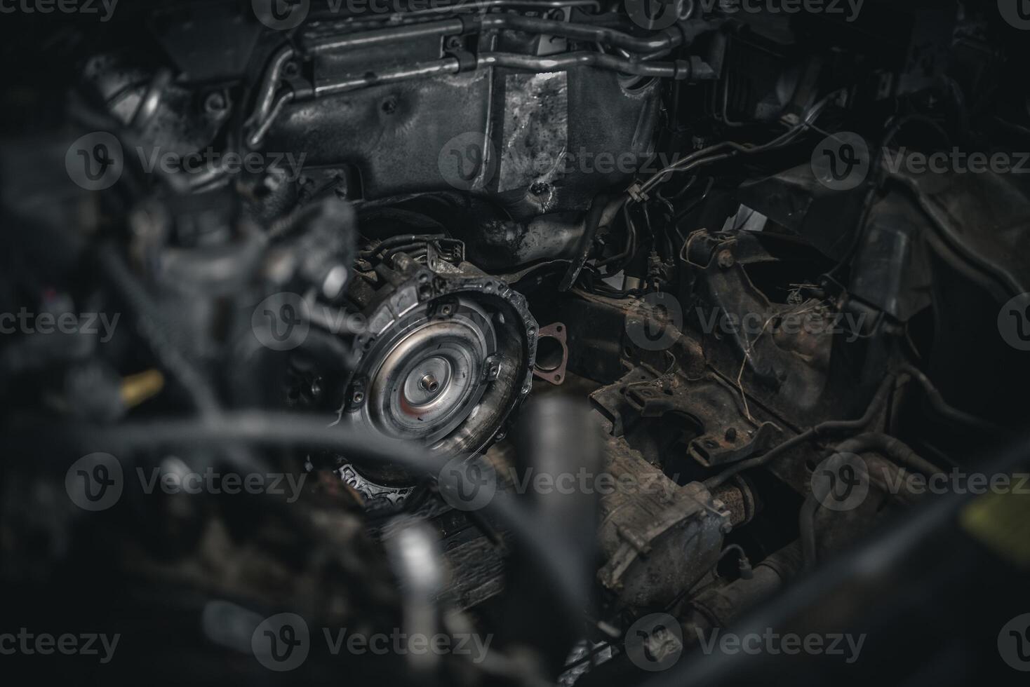 Torque converter sticking out of automatic transmission with engine removed on a modern car. photo