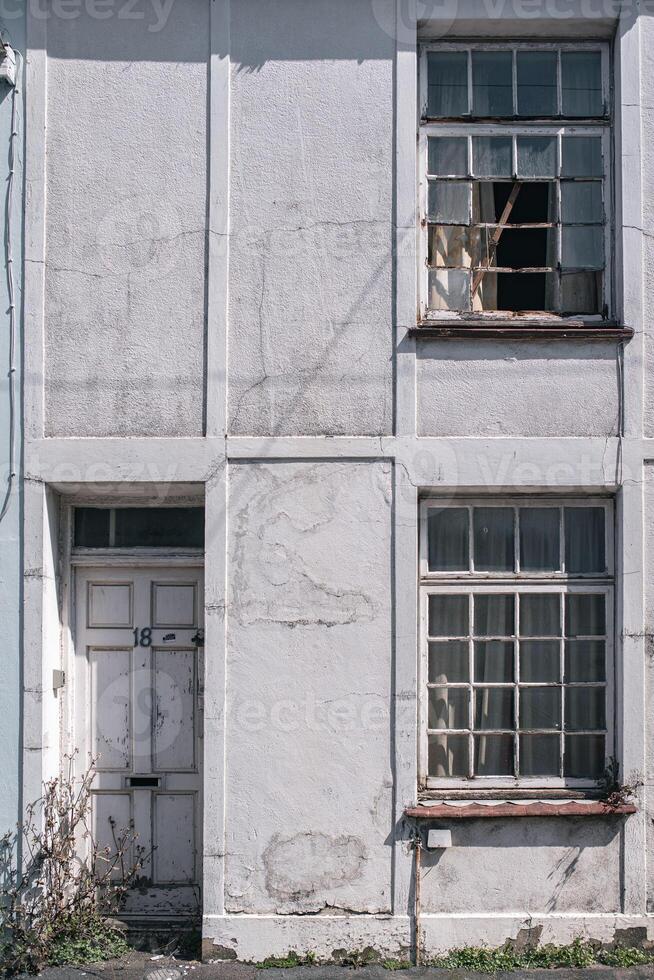 Old entrance to an abandon house in Brighton, East Sussex, UK photo