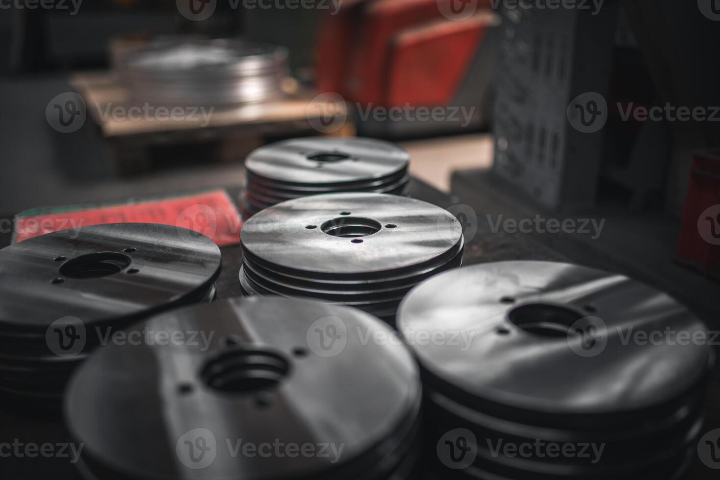 Close up of small metal disks stacked up after production photo