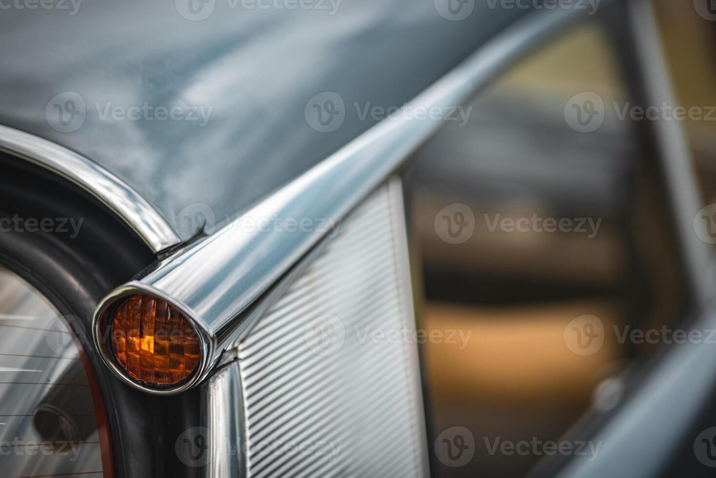 Rear quoter panel and a yellow indicator of an old classic french car on a classic car show. photo