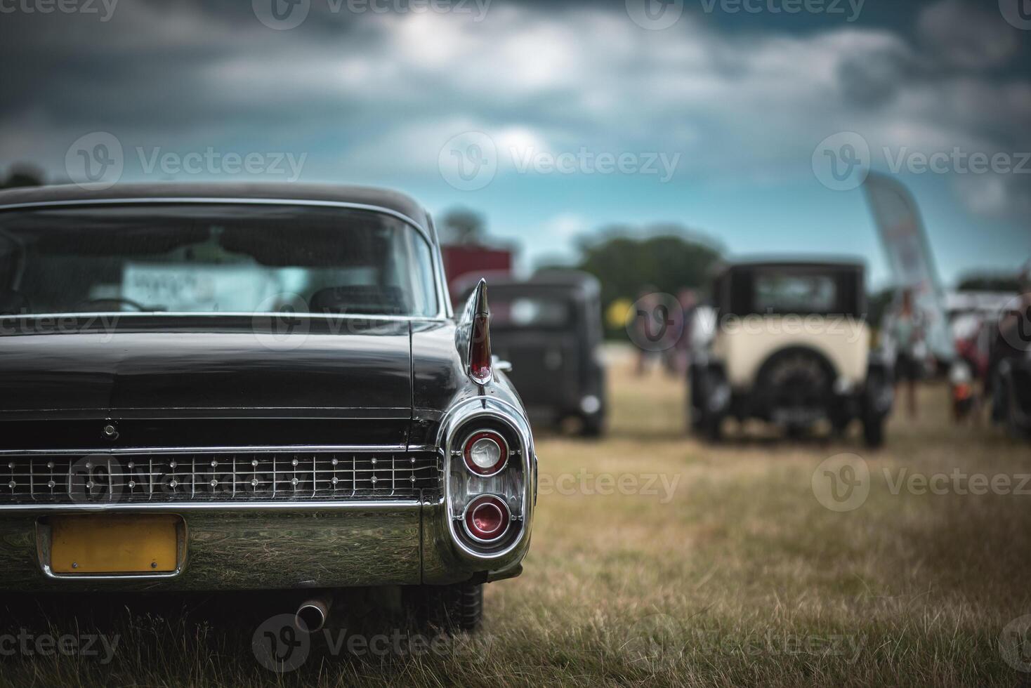 Rear light and a chrome bumper of a old french car on a classic car show. photo