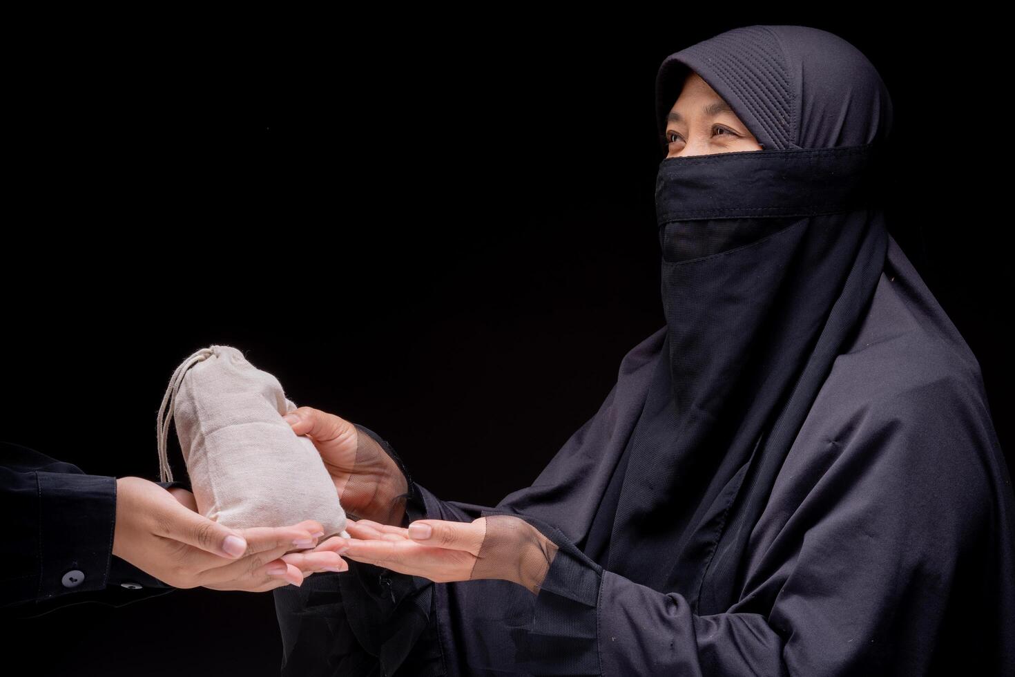 Hands are holding a pile of grain to zakat, the Islamic zakat concept. Muslims help the poor and needy. Conceptual shoot for property, income, and fitrah zakat. photo